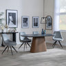 Danetti Dark Grey Ceramic Oval Dining Set with Bronze Pedestal Base - Arctic Grey Velvet Fabric Swivel Dining Chair-2
